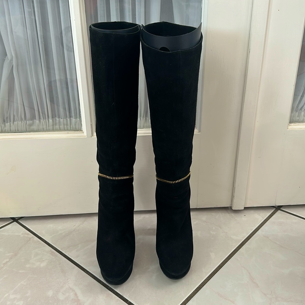 Black platform boots with gold zipper